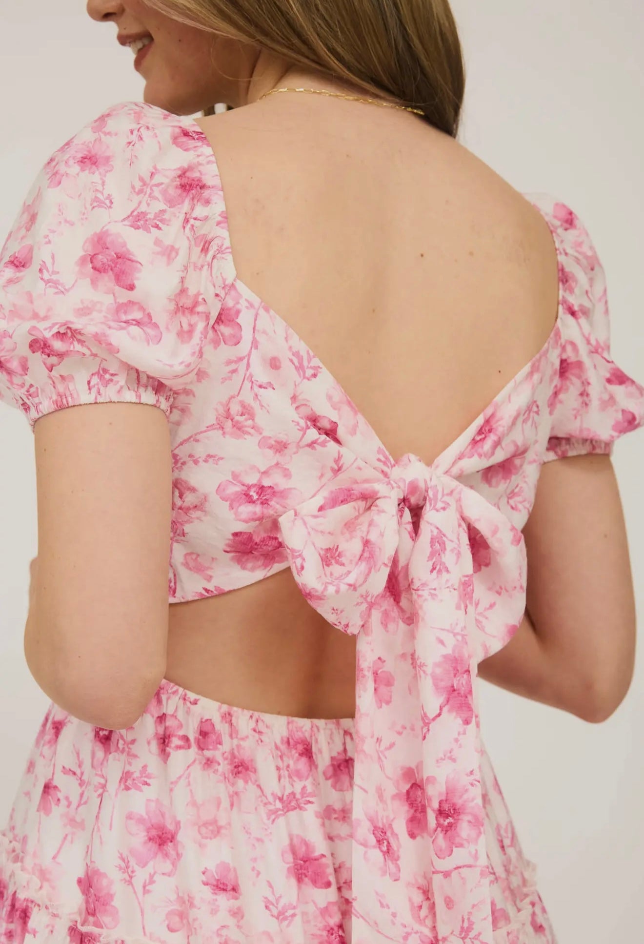 Pink Floral Open Back with Tie Tiered
Mini Dress