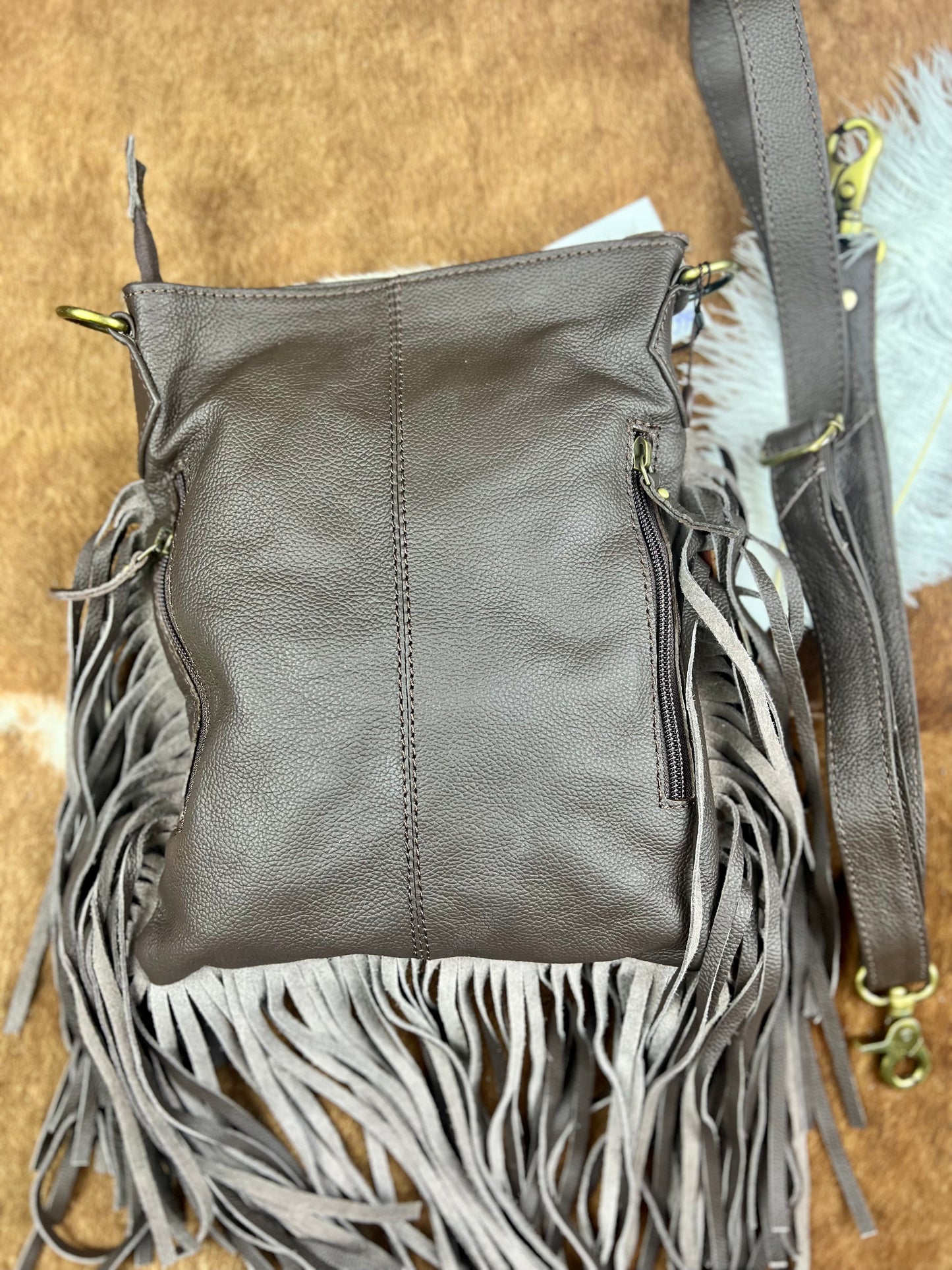 Fringe-Adorned Cowhide Bag with Crossbody Strap and Tote Handle